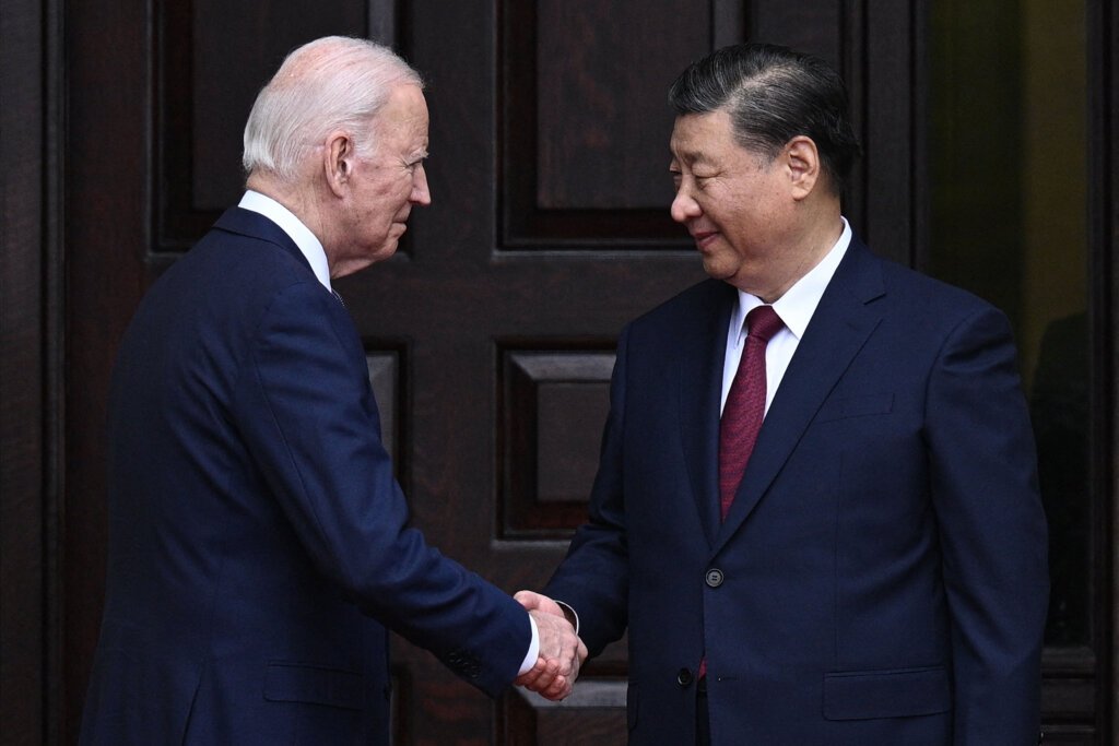 US President Joe Biden greets Chinese President Xi Jinping before a meeting during the Asia-Pacific Economic Cooperation (APEC) Leaders' week in Woodside, California on November 15, 2023. They aimed to lessen US-China tensions. (Photo by Brendan SMIALOWSKI / AFP).