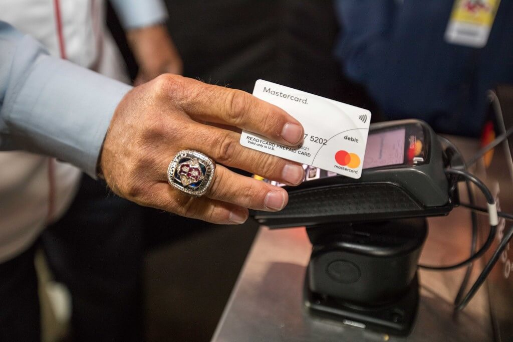 A Mastercard contactless terminal being used at the baseball World Series.