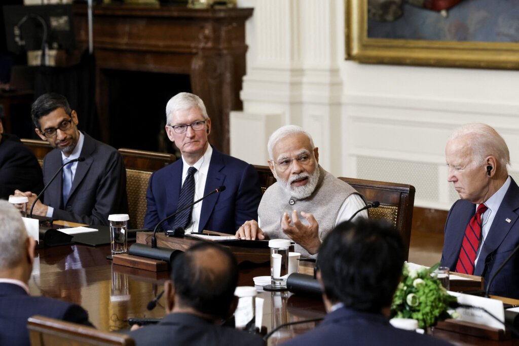 WASHINGTON, DC - JUNE 23: Indian Prime Minister Narendra Modi speaks during a roundtable with American and Indian business leaders alongside U.S. President Joe Biden in the East Room of the White House on June 23, 2023 in Washington, DC. Biden and Modi held the meeting to meet with a range of leaders from the tech and business worlds and to discuss topics including innovation and AI. People in attendance included Google CEO Sundar Pichai (L) and Apple CEO Tim Cook (2nd from left). Anna Moneymaker/Getty Images/AFP (Photo by Anna Moneymaker / GETTY IMAGES NORTH AMERICA / Getty Images via AFP)