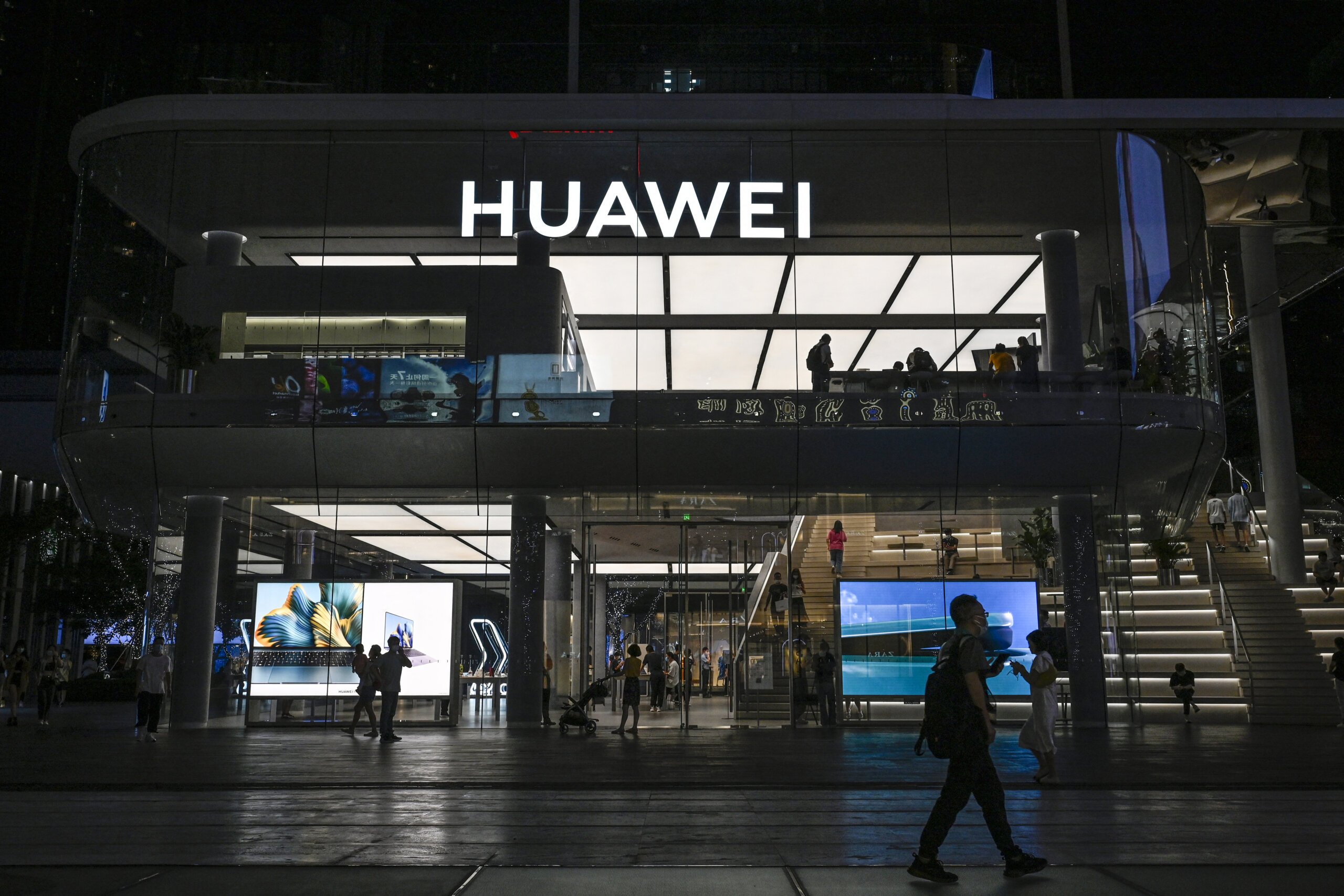 Huawei’s consumer business group, including Huawei smartphones and smart car solutions, recorded growth and increased revenue for the first time in three years. Source: (Photo by Jade GAO / AFP)