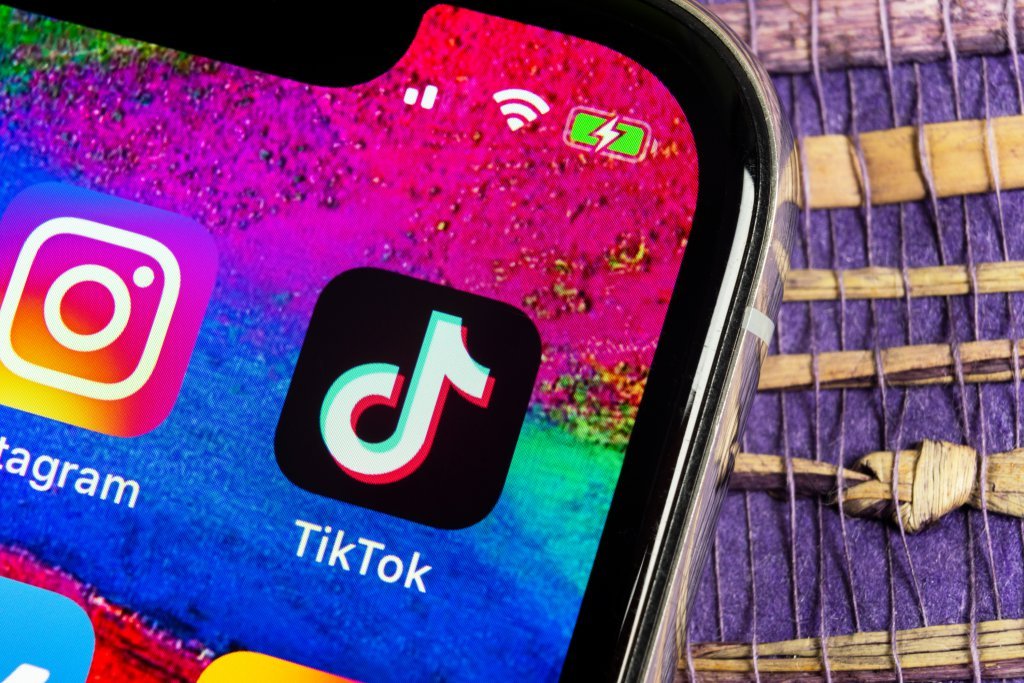 TikTok application icon on Apple iPhone X screen