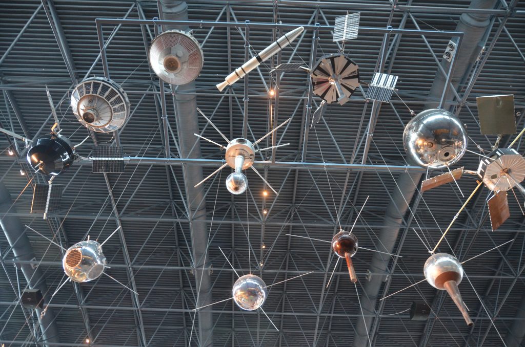 Image of models of satellites; illustrative image for article on smartphone-to-satellite technology.